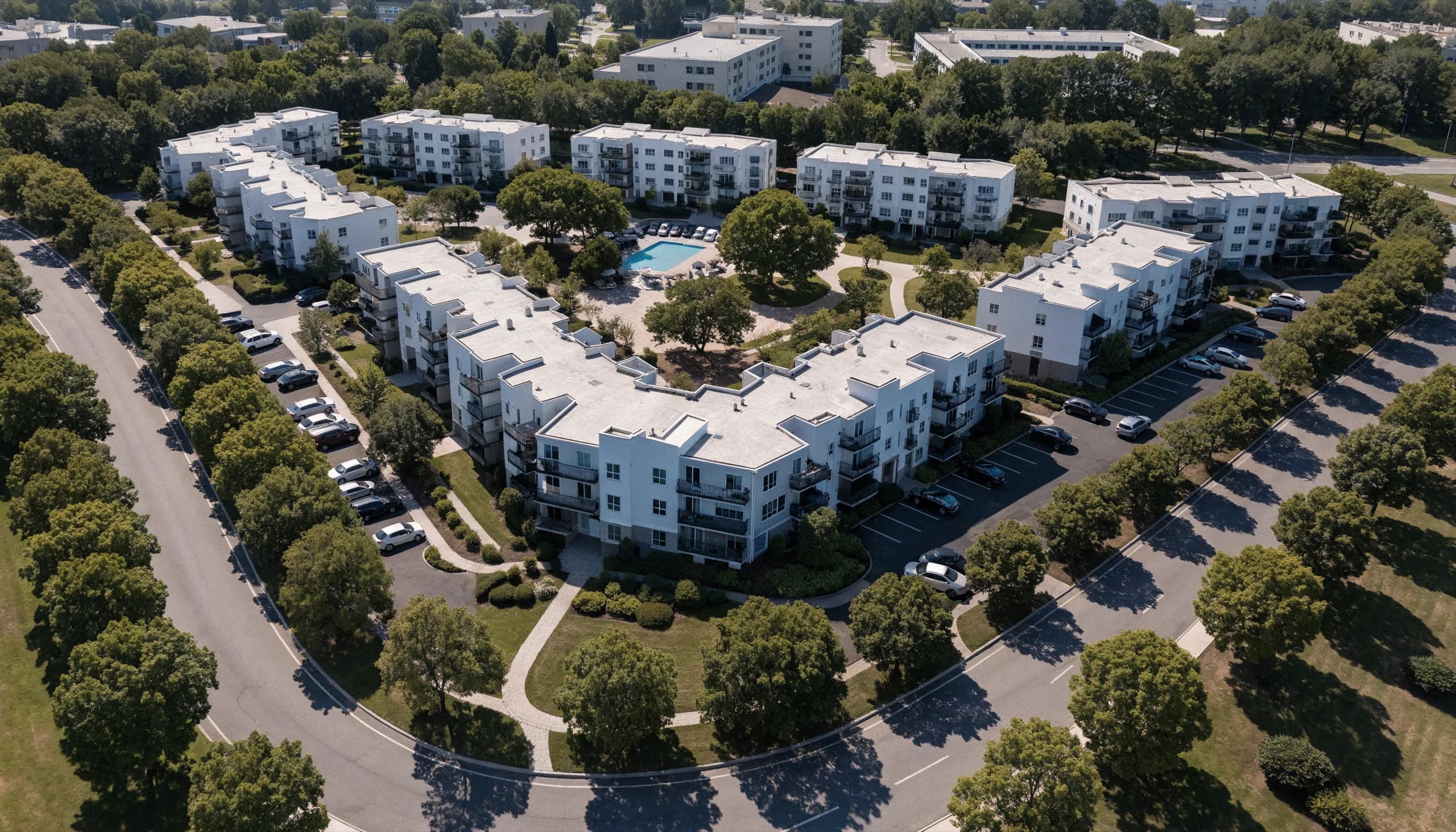 Apartment community seen from above at dusk.